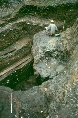 A person in a hard hat sitting on a rock

AI-generated content may be incorrect.