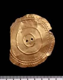 A gold button with holes

AI-generated content may be incorrect.