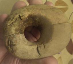 A hand holding a stone object

AI-generated content may be incorrect.