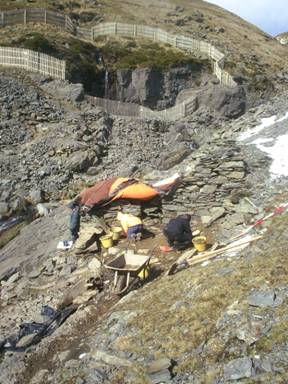 A group of people working on a rocky hillside

AI-generated content may be incorrect.